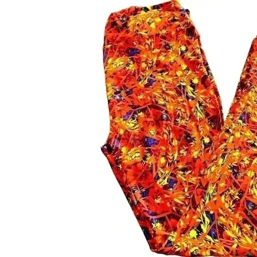 Lularoe TC orange , blue & yellow floral leggings. Pattern over pattern.NWOT.